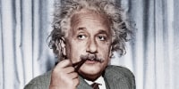 Albert Einstein smoking a pipe.