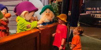 Drew Patchin, center, and his brother Tyler greet some of the Seven Dwarves at Disney World.